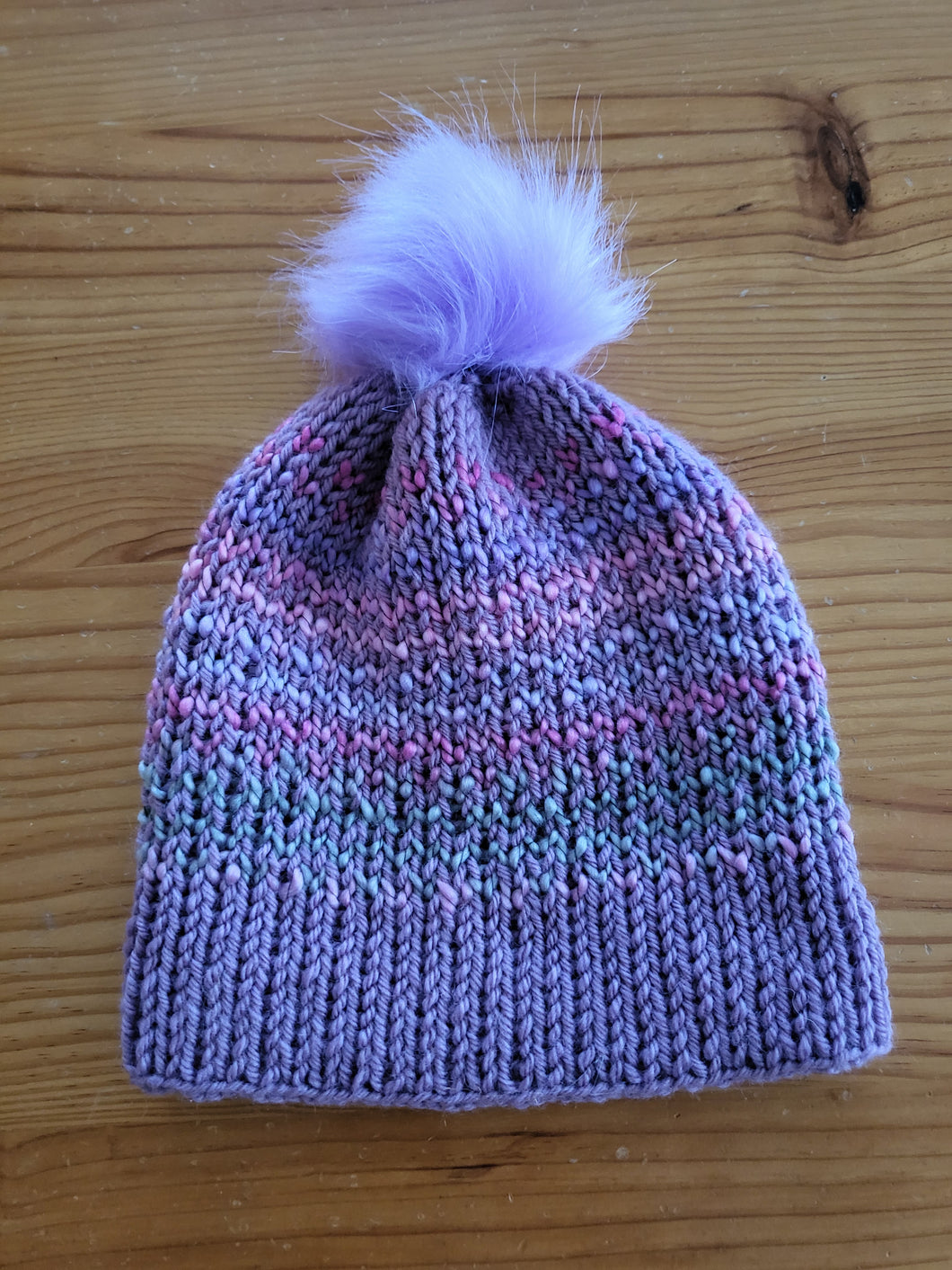Beanie - mauve with shades of pink and blue and mauve pom pom