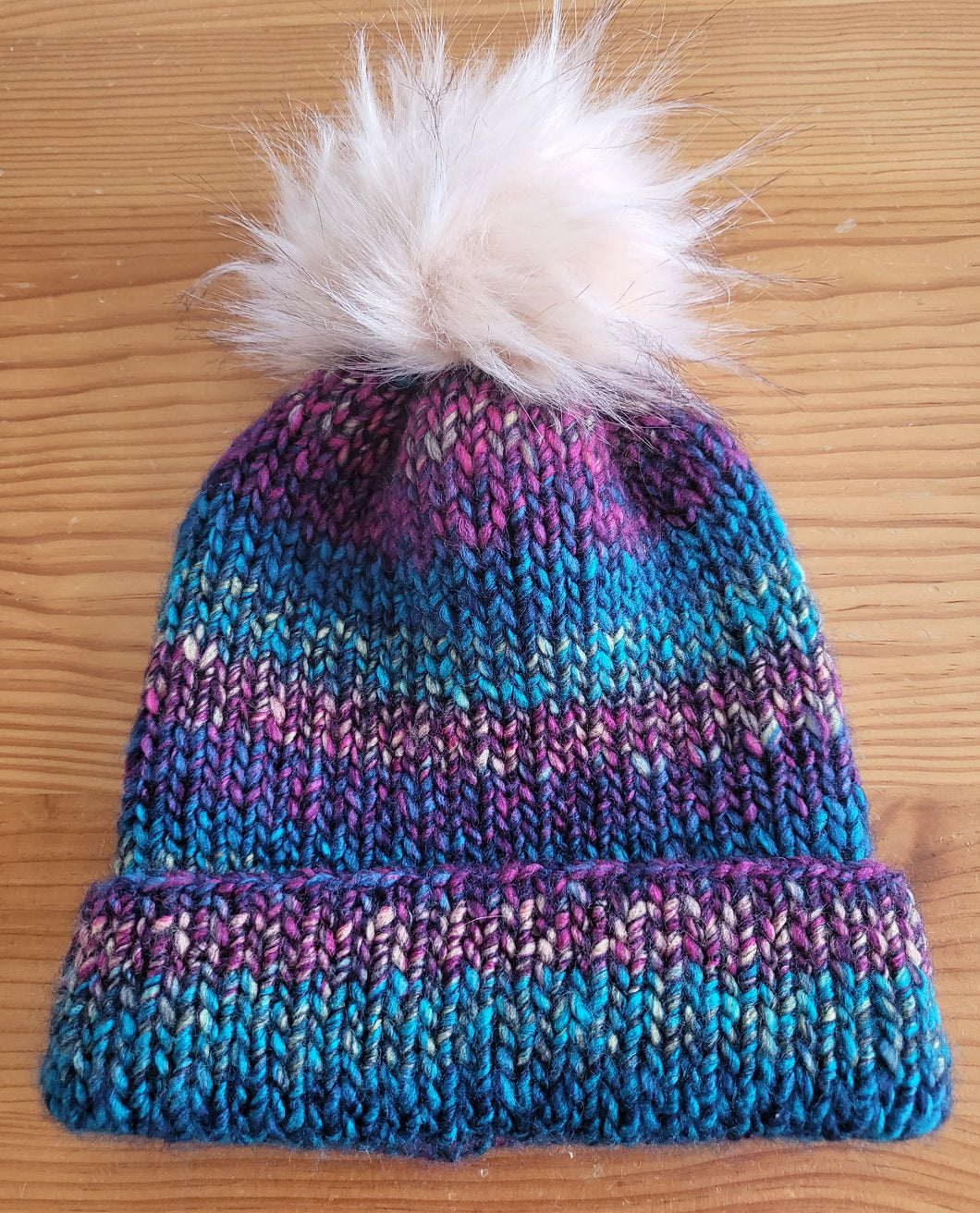 Beanie - purple green and beige entwined with beige pom pom